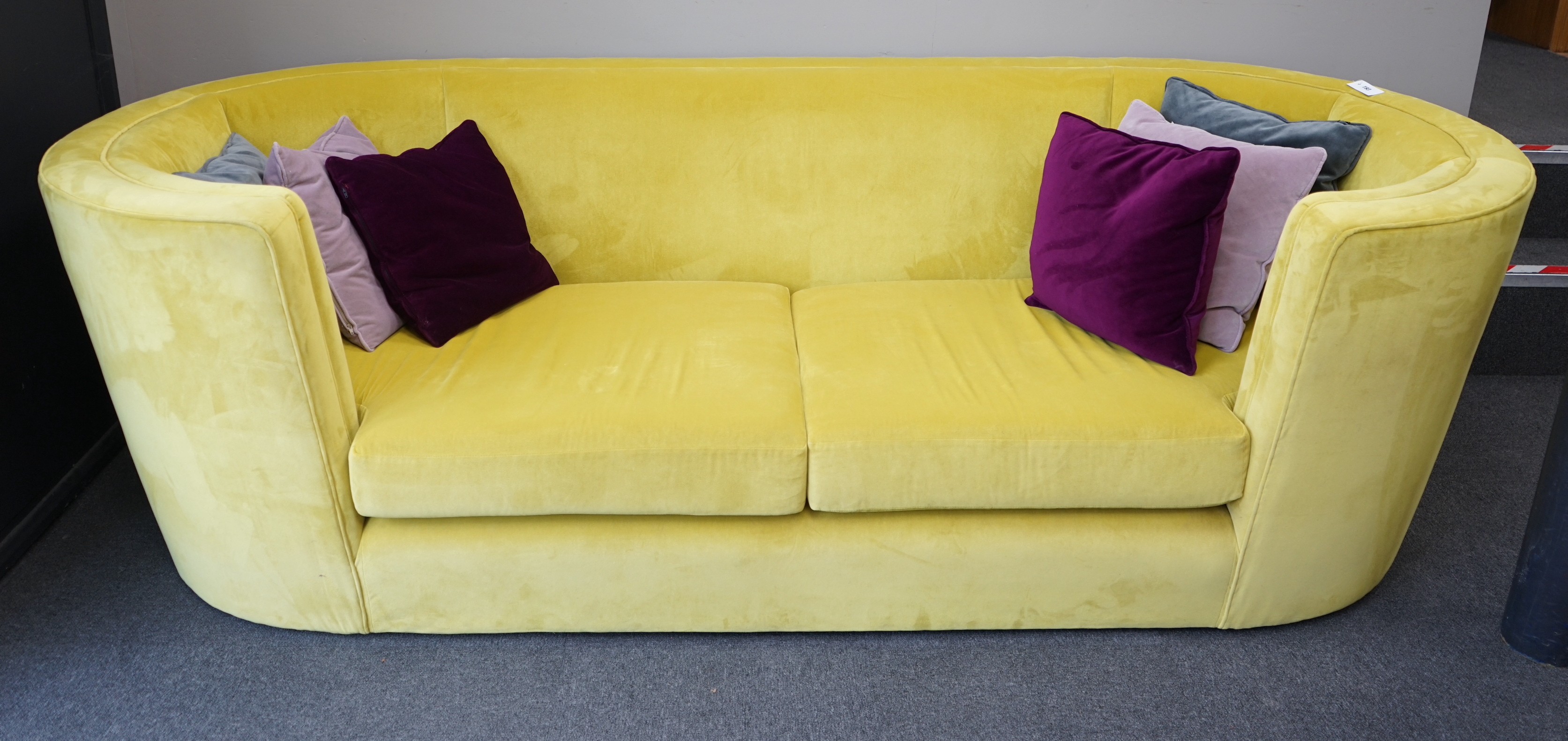 A contemporary Conran tub framed settee, upholstered in Italian Wattle velvet, with up to date fire safety standards, length 250cm, depth 102cm, height 78cm